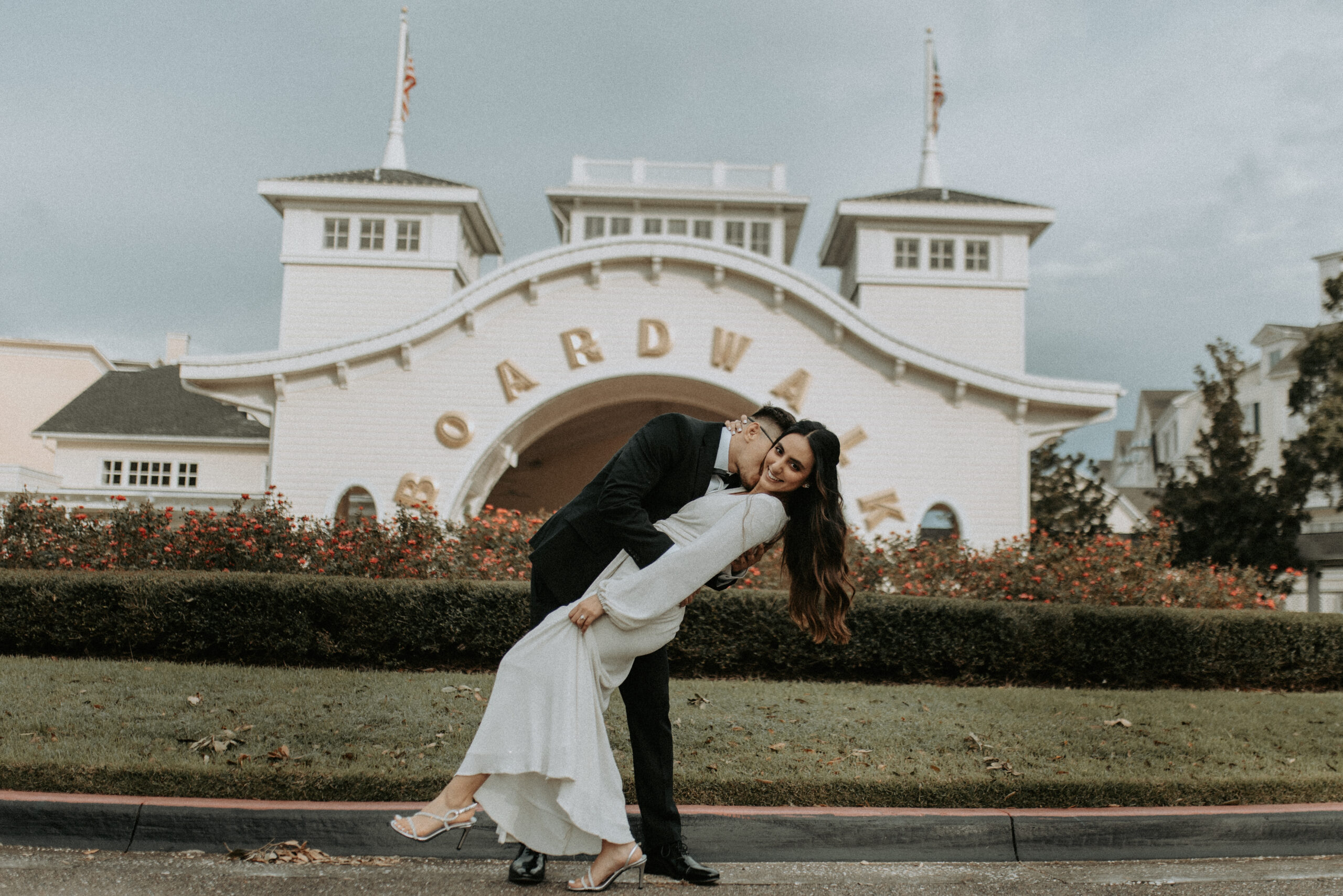 Engaged couple at the Disney Boardwalk entrance